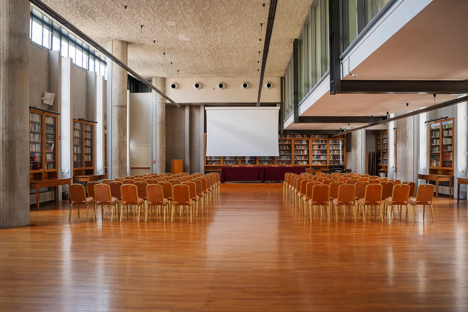 Library Hall set up theatre-style with bookshelves